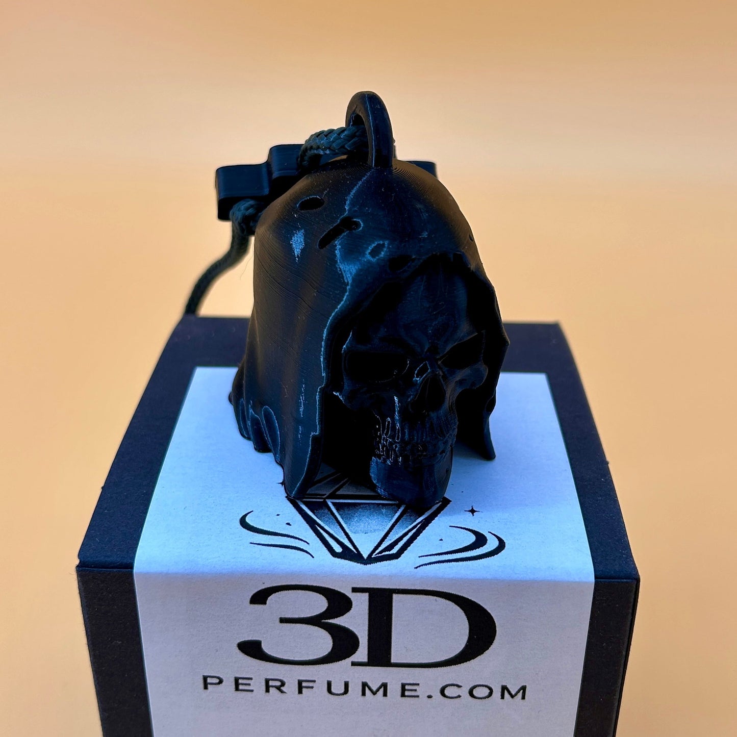 Black 3D perfume bottle on a black box with '3D Perfume.com' label against a beige background